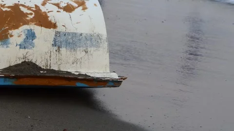Old boat on the beach Stock Footage 245843605