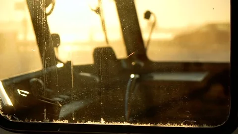 Old boat cabin with steering hand wheel and dashboard inside through the window Stock Footage 73824517