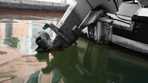 Old boat with engine and reflection in water Venice Video stock 80691187