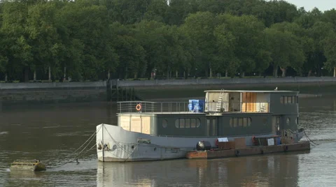 Old boat moored on the River Thames in London Stock Footage 61052286