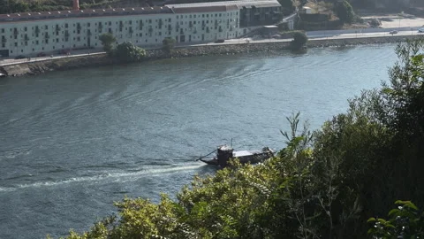 Old boat navigating Douro River Porto Portugal 動画素材 209319285