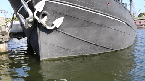 Old boat on the water with anchor and water reflection Stock Footage 162920249