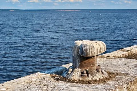 Old bollard for mooring the vessel Stock Photos