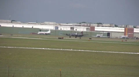 Old bomber landing Stock Footage 8694393