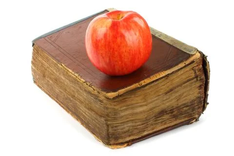 Old book with apple Stock Photos