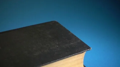 Old Book Falls on the Table Stock Footage 83265081