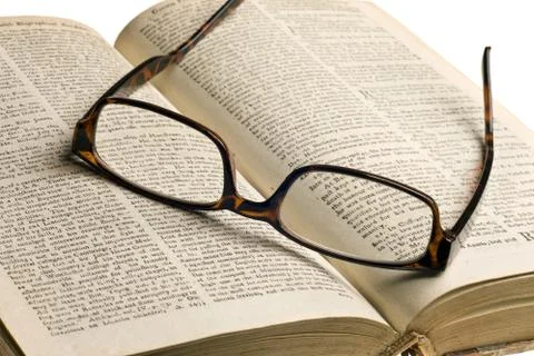 Old book with glasses Stock Photos
