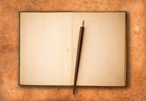 Old book with pen Stock Photos