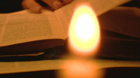 Old book reading with candles Stock-Footage 756276