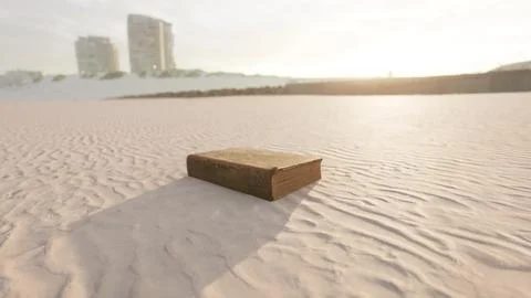 Old book on the sand beach Stock Illustration