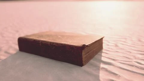 Old book on the sand beach Stock Illustration