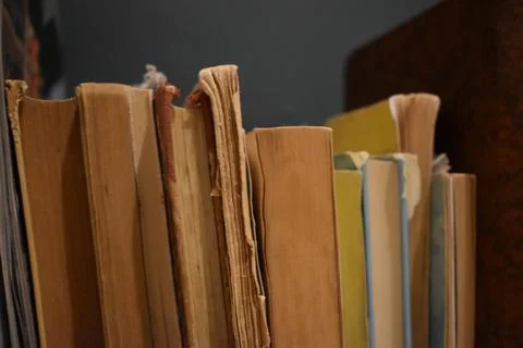 Old book stack on the rustic table Stock Photos