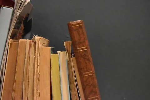Old book stack on the rustic table Stock Photos