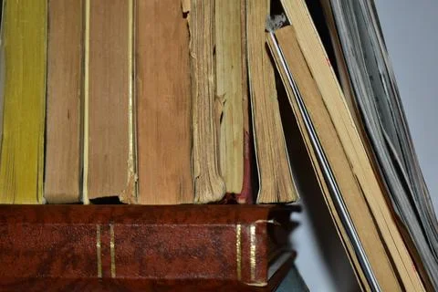 Old book stack on the rustic table Stock Photos