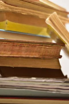 Old book stack on the rustic table Stock Photos