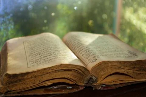 Old book on table Stock Photos