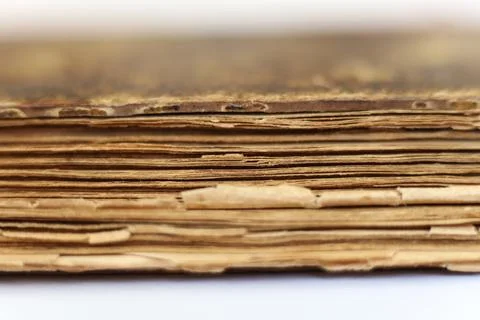 Old book on white background. Close-up. Shallow DOF. Stock Photos