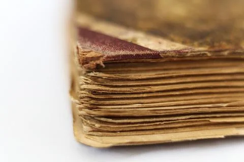 Old book on white background. Close-up. Shallow DOF. Stock Photos