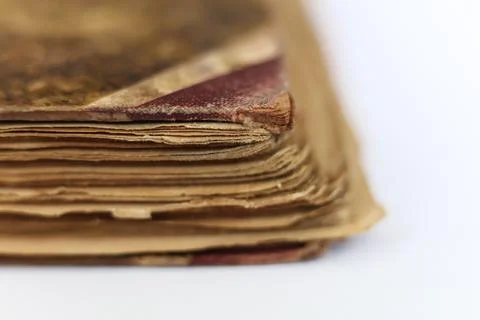 Old book on white background. Close-up. Shallow DOF. Stock Photos