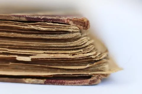 Old book on white background. Close-up. Shallow DOF. Stock Photos