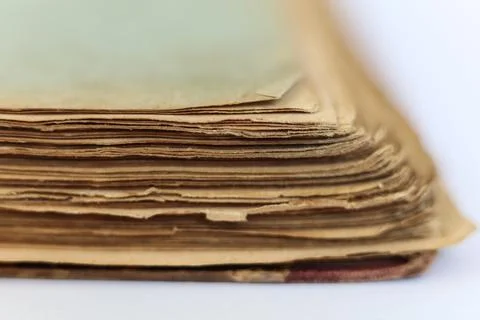 Old book on white background. Close-up. Shallow DOF. Stock Photos