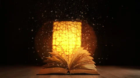 Old book on wood table with magic lights and bright flying letters on a dark Stock Footage 313243284