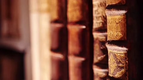 Old books in a bookshelf Stock Footage 63610818