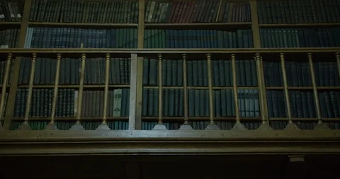 Old books on library shelf Video stock 86511098