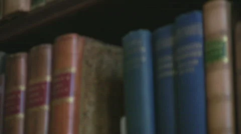 Old books on a shelf Stock Footage 577622