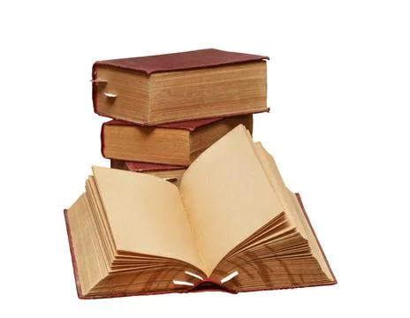 Old books A stack of old books on a white background. One book is open, cl... 库存照片