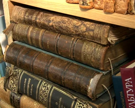 Old books on the table Stock Footage 55622955