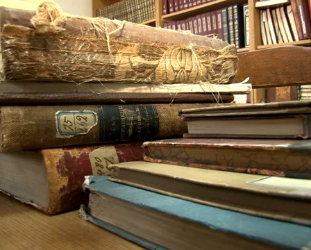 Old books on the table Stock Footage 55622970