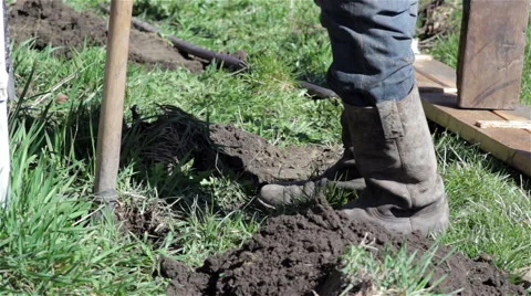 Old boots digging the ground Stock Footage 61793409