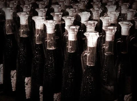 Old bottles aligned on the table Stock Photos