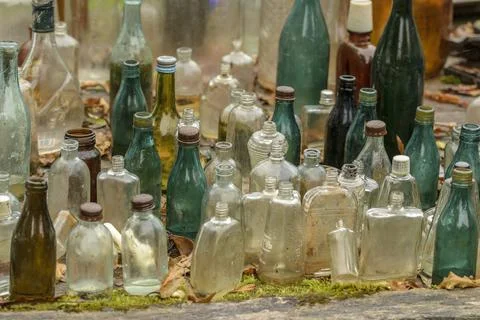 Old bottles of various drinks. Stock Photos