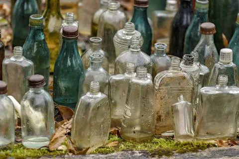 Old bottles of various drinks. Stock Photos