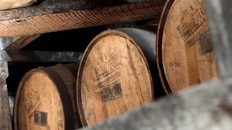 OLD BOURBON BARRELS IN KY RICK HOUSE Stock Footage
