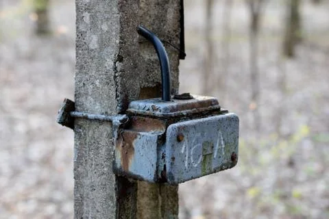 Old box used for electrical installations. Space for wires and electric fuses Stock Photos