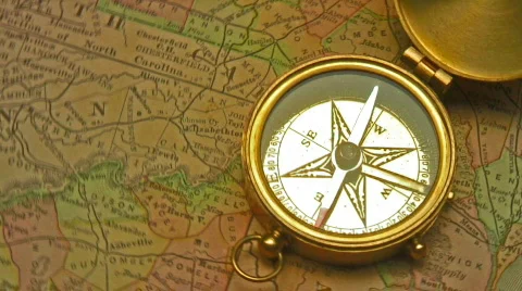 Old brass compass over antique map Video stock 688867