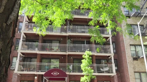 Old brick architecture of a unique New York apartment condomonium building w Stock Footage 242365820