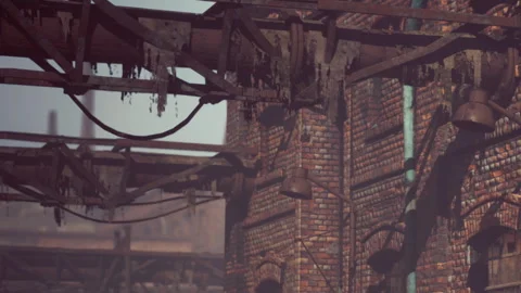 Old brick building in a factory area with pipes and rust Stock Footage 343943148