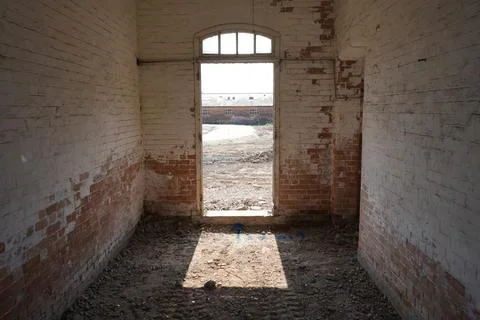 Old Brick Building Interior, Peeling Paint, Arched Doorway, Bulcote, England. Stock Photos