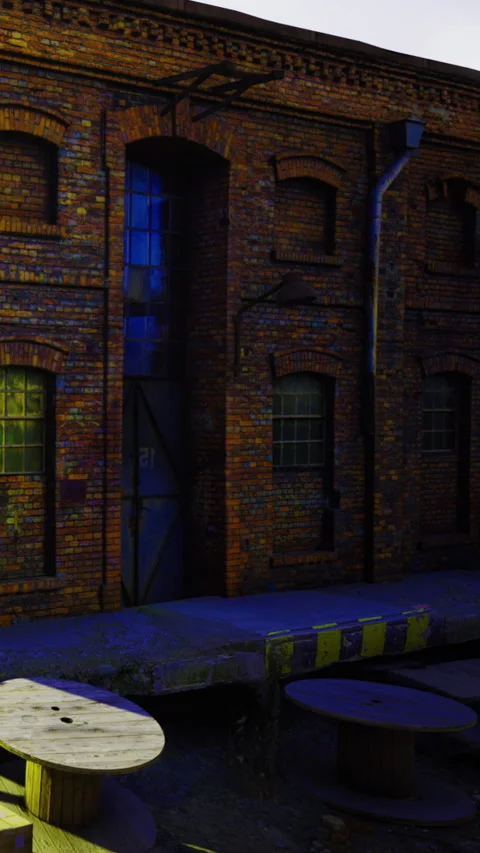 Old brick building with large windows near a wooden platform Stock Footage 334890381