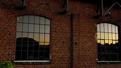 Old brick building with sunset in windows Stock Footage 111963556