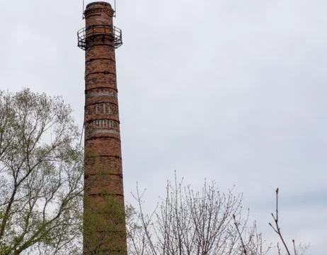 Old  Brick Chimney On Sky Background Foto stock