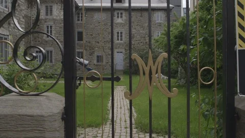 Old Brick House Behind Designed Fence Stock Footage 118618269