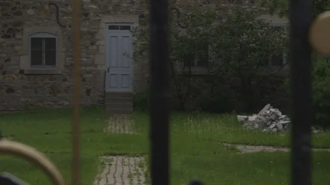 Old Brick House Behind Designed Fence Stock Footage 118618326