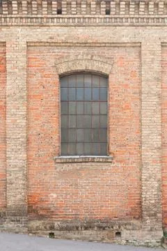 Old brick house with window protected with gratings Stock Photos
