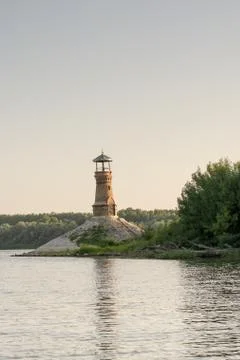 Old brick lighthouse on the river with clear sky Stock-Fotos