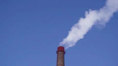 Old brick pipe smokes against the sky Stock-Footage 73327143